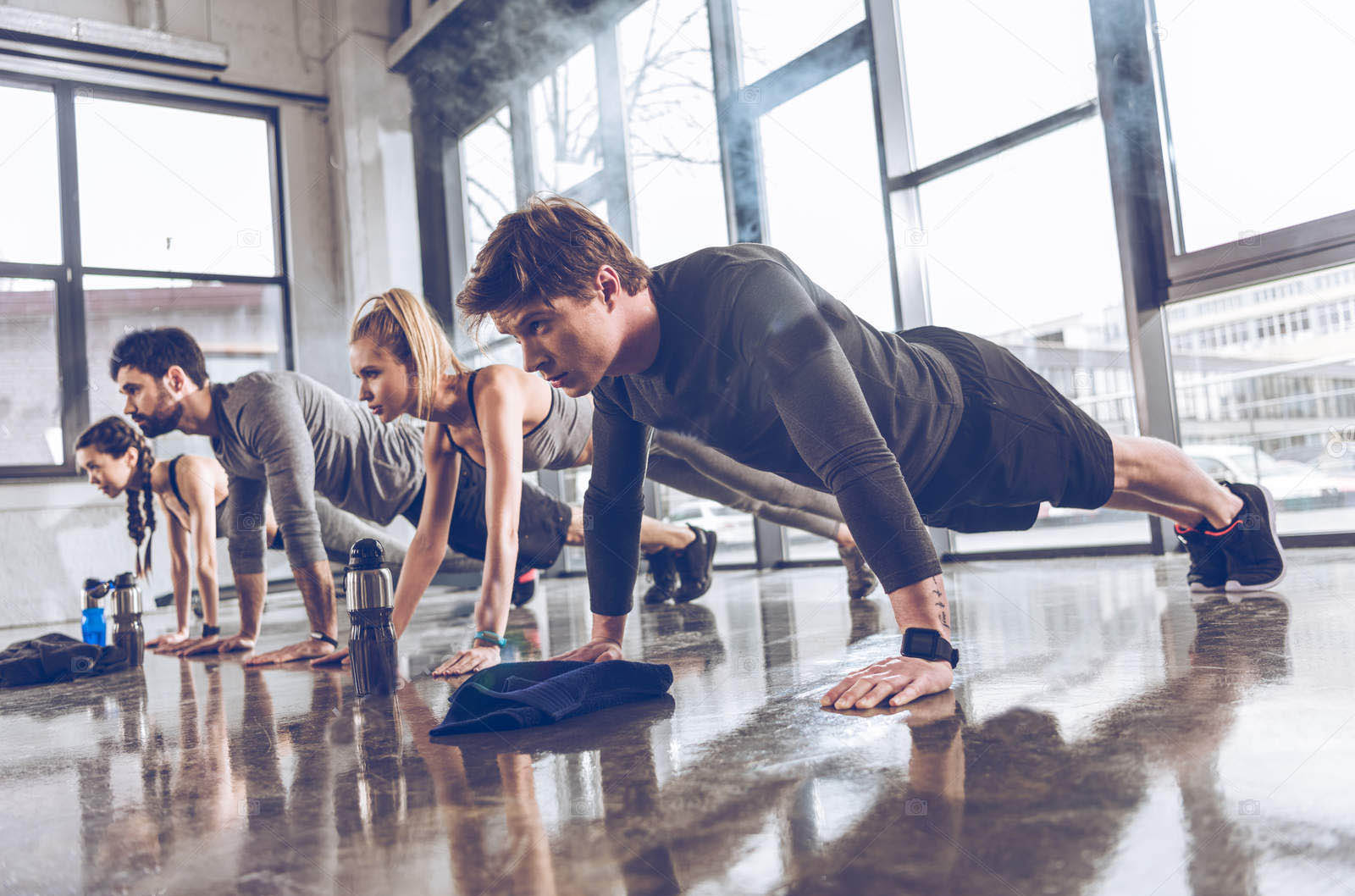 depositphotos_153032408-stock-photo-sporty-people-exercising-in-gym-LAY